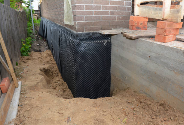 Happy homeowners after waterproofing job in Elko New Market